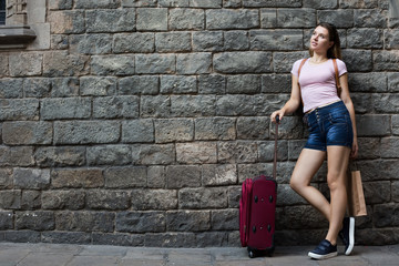  tourer standing on stone wall background