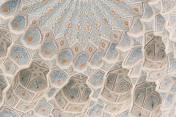 The ceiling is carved with ancient Asian ornament. the details of the architecture of medieval Central Asia