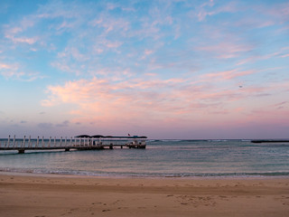 Pier early in the morning at Waikiki beach, Honolulu, Oahu Island, Hawaii. Waikiki Beach in the center of Honolulu has the largest number of visitors in Hawaii.