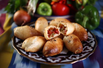 Samsa with vegetables and mutton or beef.Onion,bell pepper green and red,tomatoes, eggplant,carrot,hot pepper,cumin,salt to taste.Uzbek cuisine.