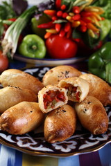 Samsa with vegetables and mutton or beef.Onion,bell pepper green and red,tomatoes, eggplant,carrot,hot pepper,cumin,salt to taste.Uzbek cuisine.The upper projection.
