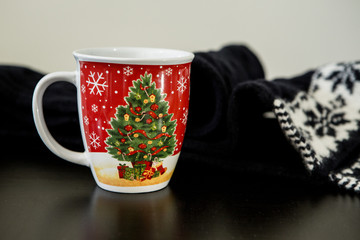 Christmas Mug with Scarf on a Table