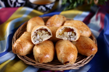 Samsa puff with potatoes with the addition of sheep fat.Sesame seeds,pepper,salt to taste.Baked in the tandoor.Uzbek cuisine.