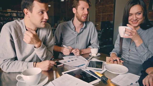 Group of young people in business meeting showing teamwork. Startup.