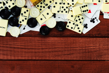 Various board games chess board, playing cards, dominoes. Hobby. Metaphor for games and gambling.
