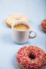 Donuts and a cup of coffee close-up