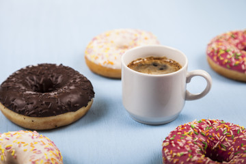 Donuts and a cup of coffee close-up
