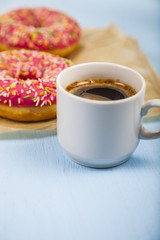 Donuts and a cup of coffee close-up