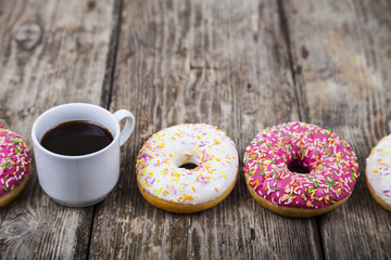 Donuts and a cup of coffee close-up