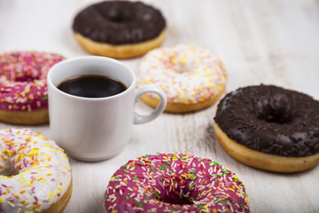 Donuts and a cup of coffee close-up