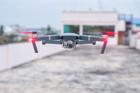 Black drone hovering from the ground