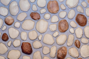 Background of the decorative stone wall with round stones