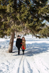 Fototapeta na wymiar Couple on winter in forest