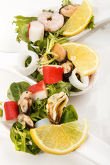 fresh seafood salad with sliced lemon
