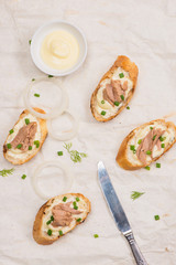 Bruschetta. Sandwich tuna fish salad on wooden background