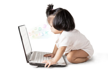 Little baby girl with laptop