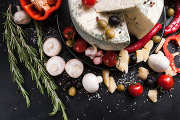 food photography art. gourmet blue cheese vegetables spices assortment mix concept