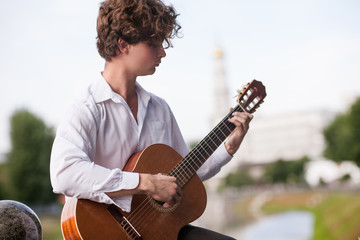 Guitar romantic man city musician concept. Playing stringed instruments lessons. Lifestyle of talented people.