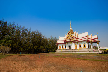 Naklejka premium buddhist temple on blue sky in thailand