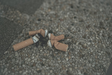 Put out the cigarette on the floor.