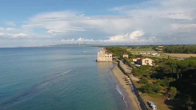 Torre Mozza castle and coastline, Tuscany aerial view.