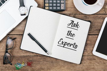 Ask the Experts on note book at office desktop