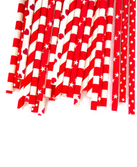 red paper straws on white background