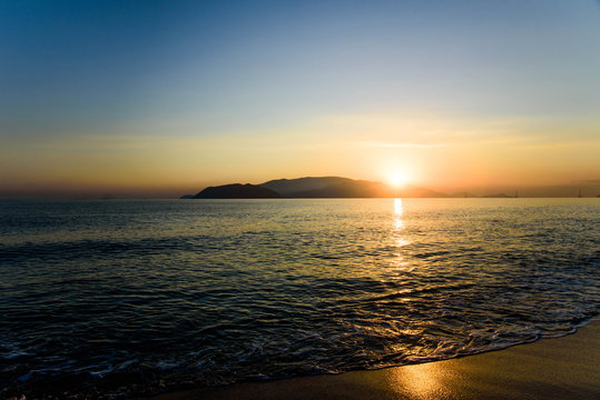 Colorful sunrise over sea and the beach with clear skies in Vietnam