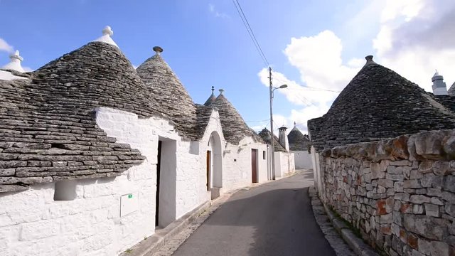 Walking on the streets of Alberobello, Apulia.