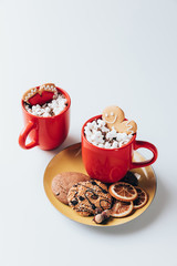 hot chocolate with marshmallows and cookies
