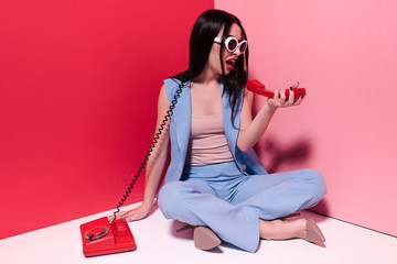stylish girl with retro phone