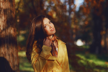 Portrait of a young happy woman in the park