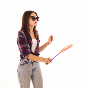 Young cute woman with fly swatter, isolated  