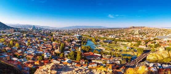 Tourustic ride on the funicular, aerial view from the top on the houses with traditional wooden carving balconies of Old Town of Tbilisi, Georgia © photoaliona