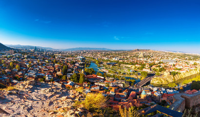 Tourustic ride on the funicular, aerial panoramic view from the top on the houses with traditional wooden carving balconies of Old Town of Tbilisi, Georgia © photoaliona