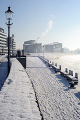 Wintertime in Holland: Deventer boulevard, snow and a frozen river