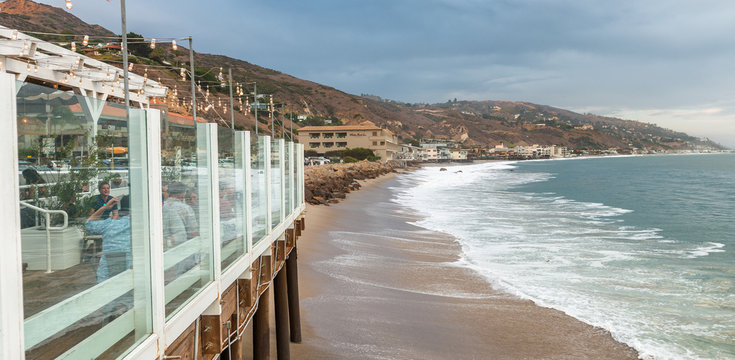 MALIBU, CA - AUGUST 1, 2017: Tourists along city coast. Malibu is a famous tourist attraction in California