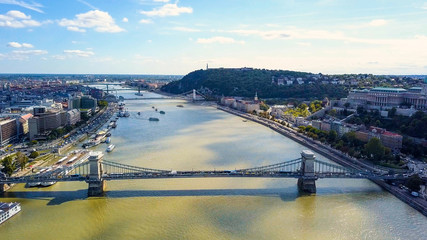 Aerial footage from a drone shows the historical Buda Castle near the Danube on Castle Hill in Budapest, Hungary. Bridge on the river. Aerial view.