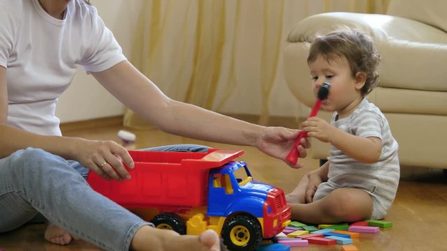 Mother and child playing in the room.
