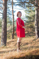 Woman in a forest in an autumn