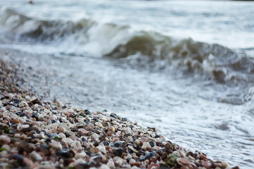 the beach pebbles with sea background