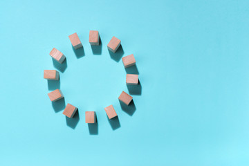 Wooden block in circle on blue background.