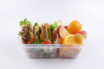 Fototapeta na wymiar Healthy lunchbox with sandwich and fruits for school chidren.