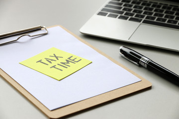 Yellow Paper Note With Words Tax Time