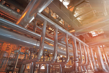 Equipment, cables and piping as found inside of a modern industrial power plant