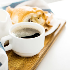 Morning coffee with croissant on the table