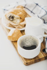 Morning coffee with croissant on the table