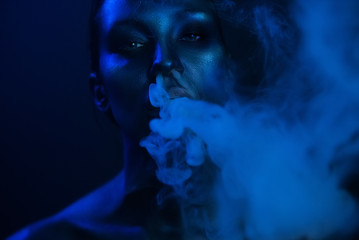 Vape Party, Nightlife. Beautiful Sexy Woman smoking