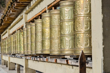 Prayer wheels of tibet in Tibet temple