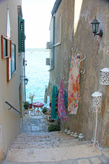 ROVINJ, ISTRIA PENINSULA, CROATIA, 30 June 2013: Beautiful romantic old town of Rovinj. View of charming narrow stone Streets with colorful shops.